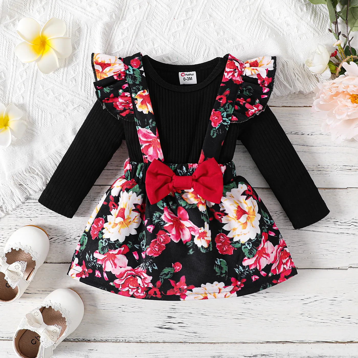 

2pcs Baby Girl Black Ribbed Long-sleeve Romper and Floral Print Ruffle Trim Suspender Skirt Set