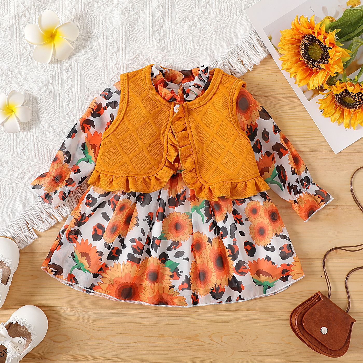 

2pcs Baby Girl Allover Sunflower Print Frill Neck Long-sleeve Dress and Solid Textured Ruffle Trim Vest Set