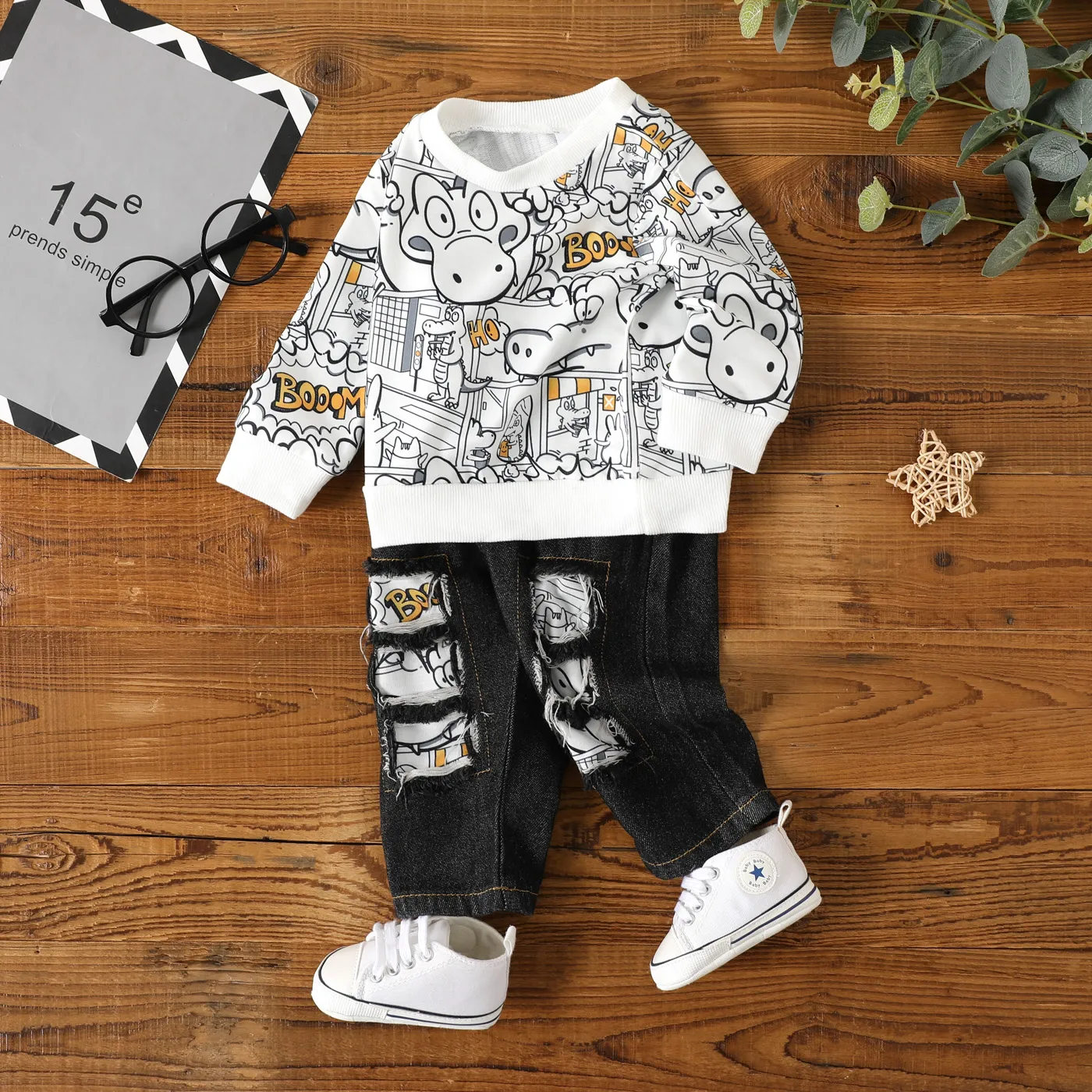 

2pcs Baby Boy 95% Cotton Ripped Jeans and Allover Cartoon Print Long-sleeve Sweatshirt Set