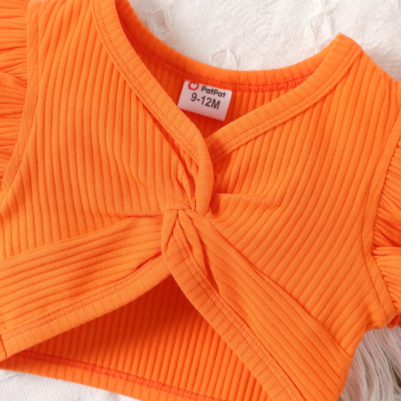 2pcs Baby Girl Solid Cotton Ribbed Ruffle-sleeve Twist Knot Crop Top and Allover Fruit Print Skirt Set  image 3