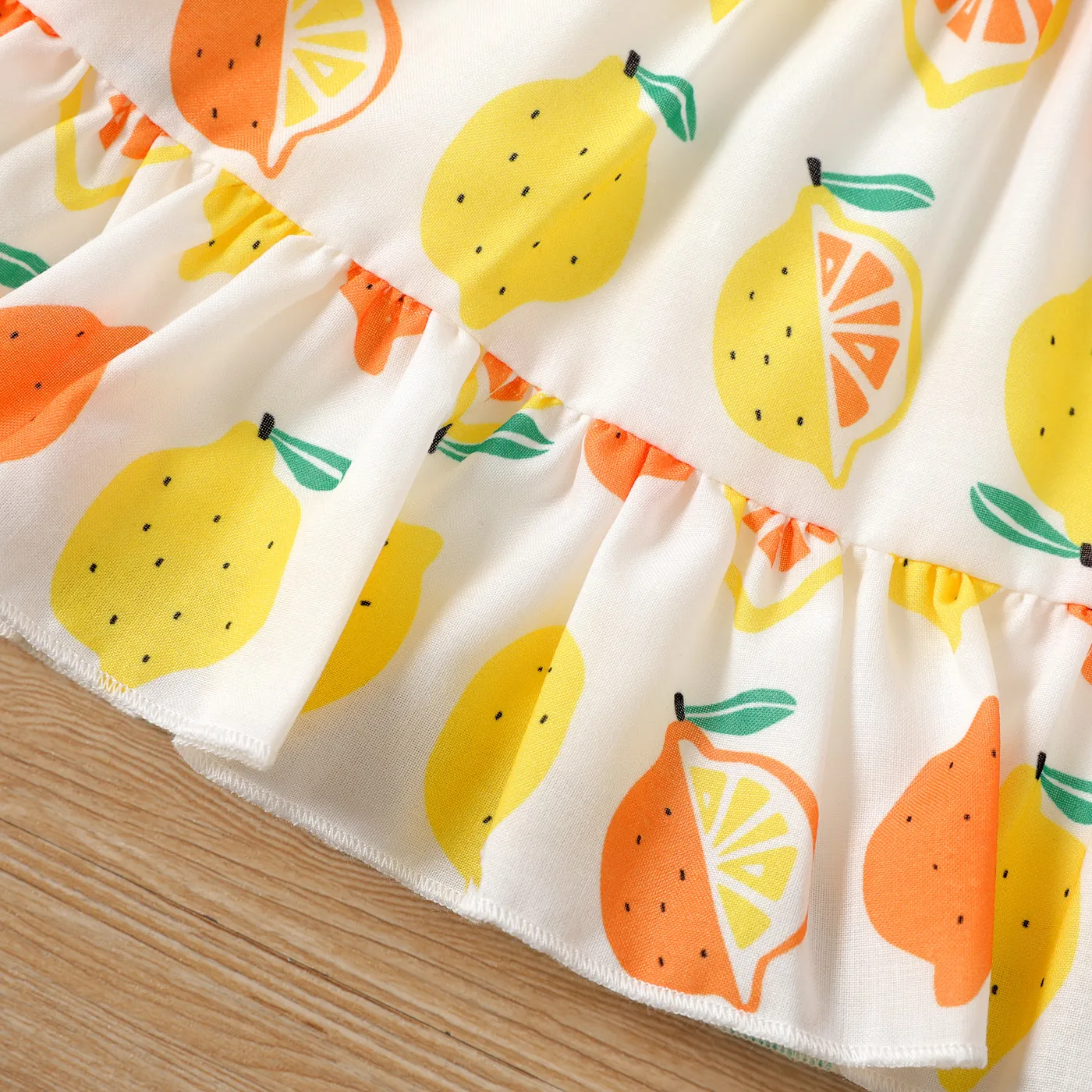 2pcs Baby Girl Solid Cotton Ribbed Ruffle-sleeve Twist Knot Crop Top and Allover Fruit Print Skirt Set  image 5