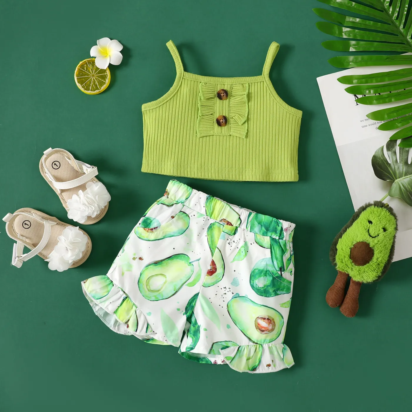 

2pcs Baby Girl 95% Cotton Ribbed Cami Top and Allover Avocado Print Ruffled Shorts Set