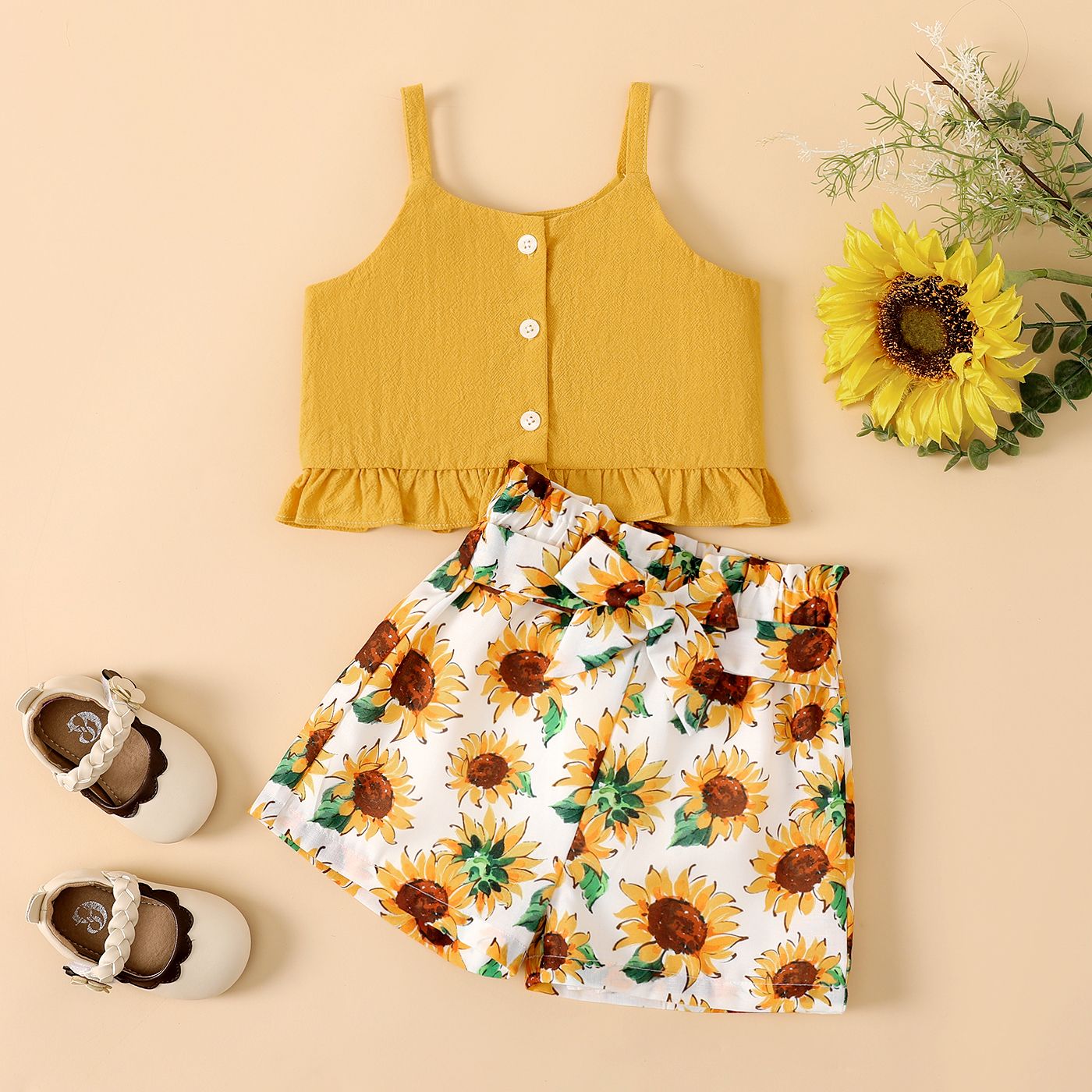

2pcs Baby Girl 100% Cotton Button Front Ruffle Hem Cami Top and Sunflower Print Belted Shorts Set