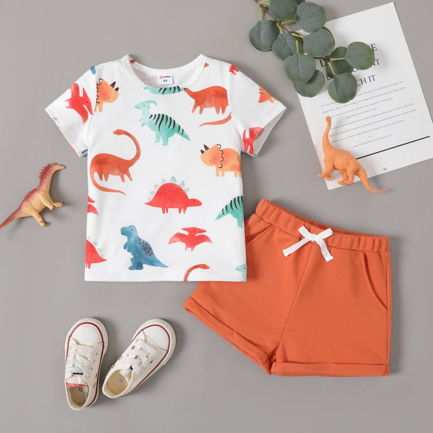 

2pcs Toddler Boy Allover Dinosaur Print Tee and Solid Shorts Set