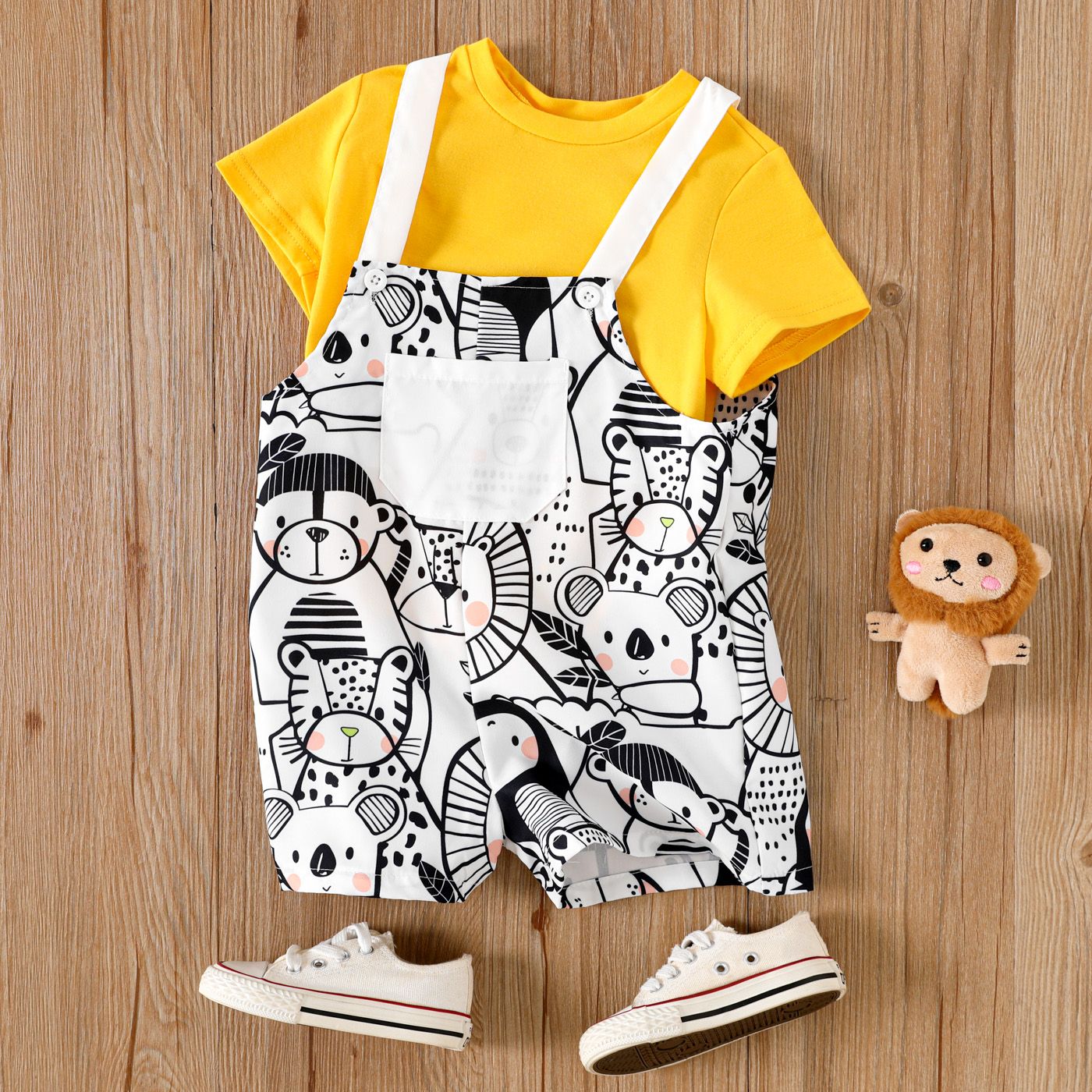 

2pcs Toddler Girl Solid Short-sleeve Tee and Allover Animals Print Strappy Pocket Overalls Set