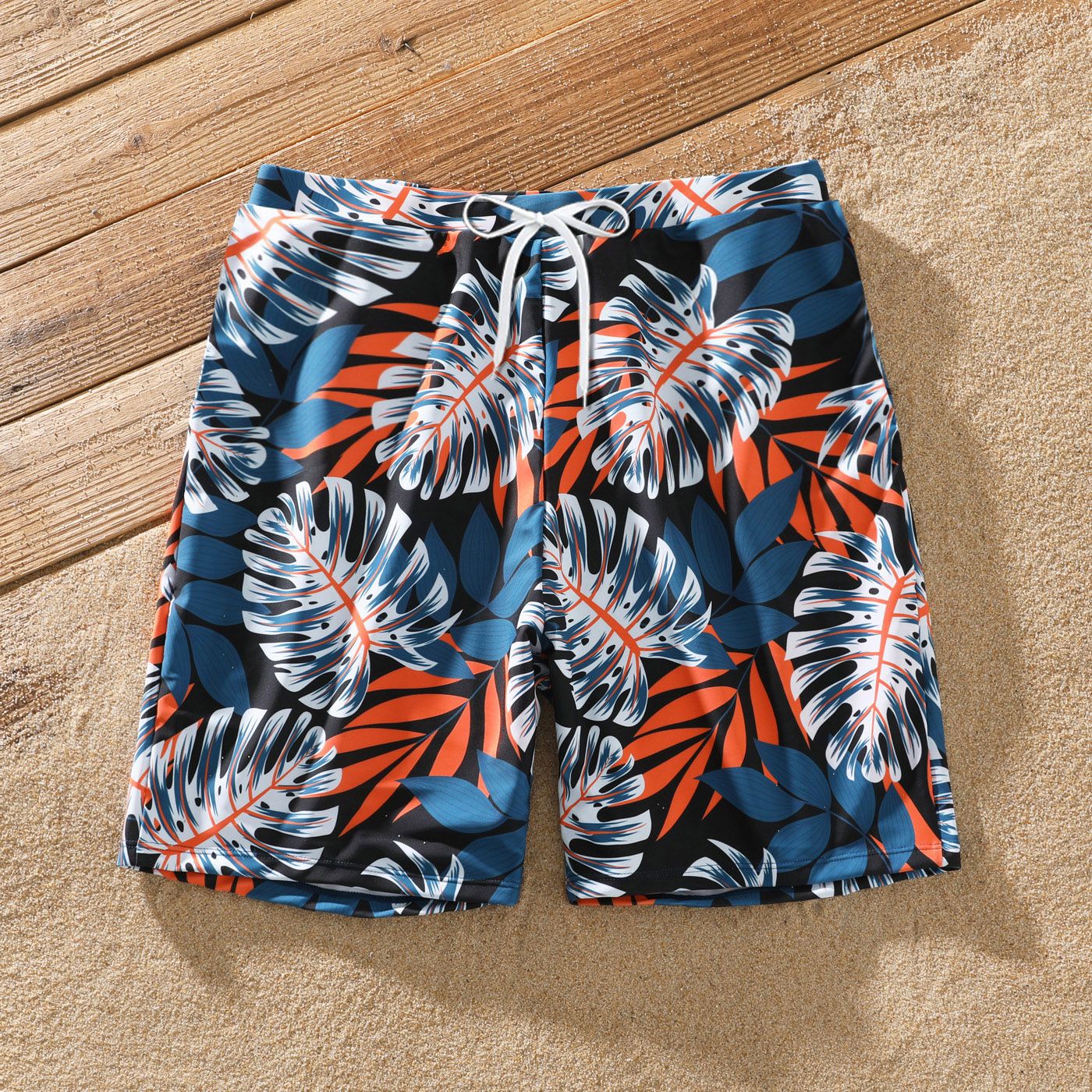 Family Matching Solid Splicing Palm Leaf Print Spaghetti Strap One-Piece Swimsuit And Swim Trunks Shorts