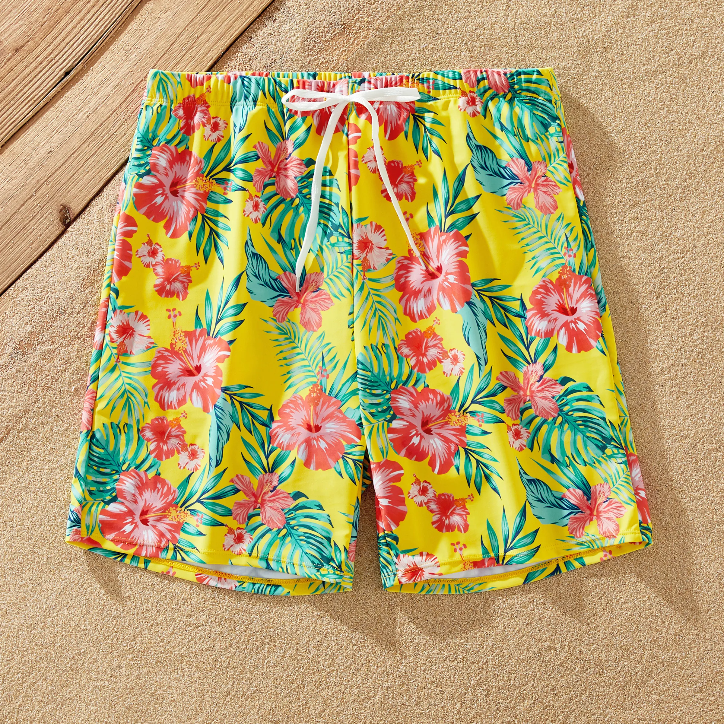 

Family Matching Yellow Tropical Drawstring Swim Trunks or Flowy Ruffle Two-Piece Swimsuit