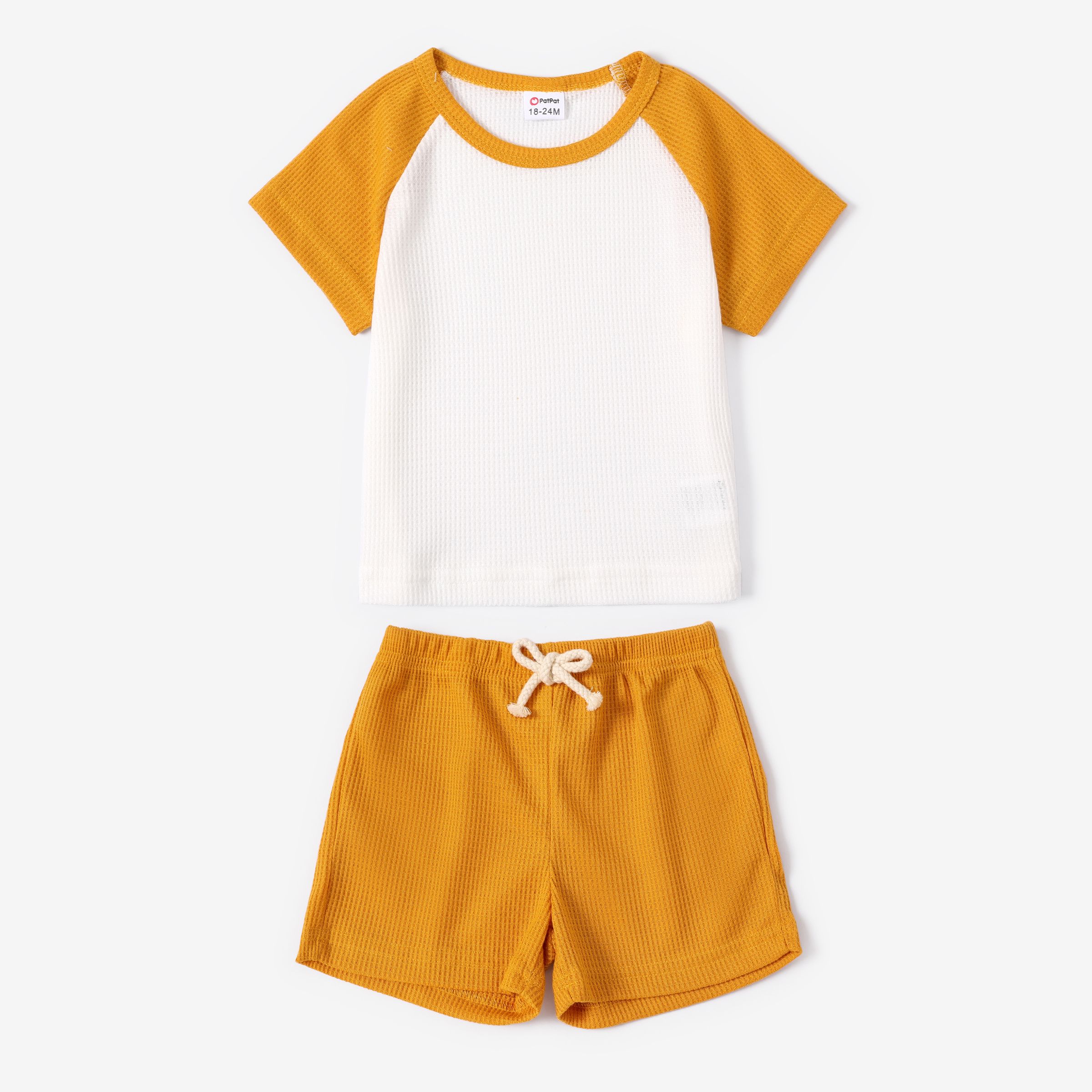 

2-piece Toddler Boy Waffle Colorblock Raglan Sleeve Tee and Solid Color Shorts Set