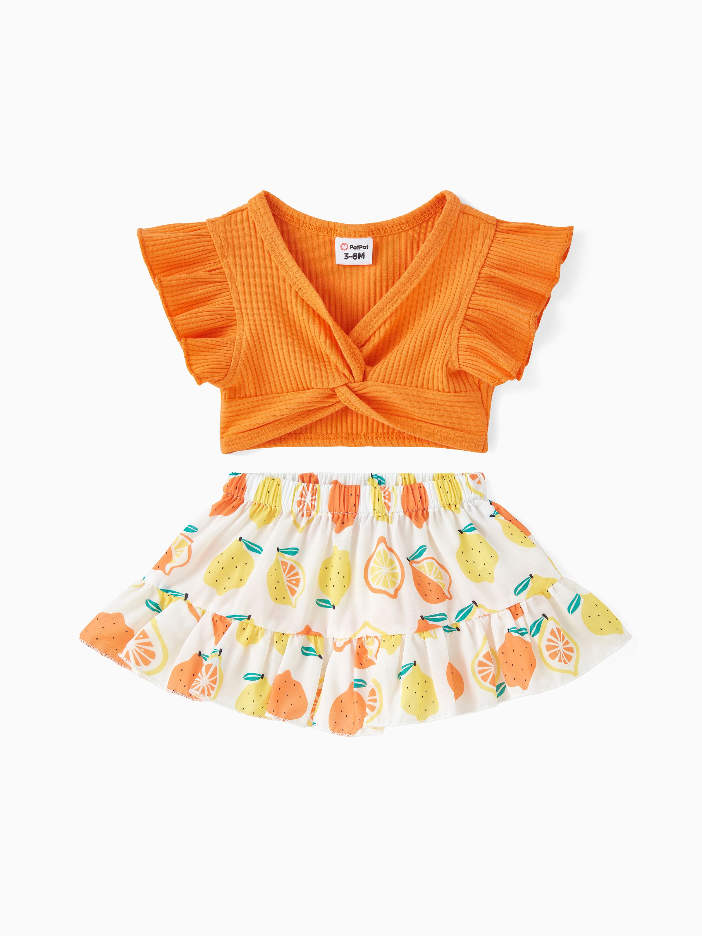 

2pcs Baby Girl Solid Cotton Ribbed Ruffle-sleeve Twist Knot Crop Top and Allover Fruit Print Skirt Set