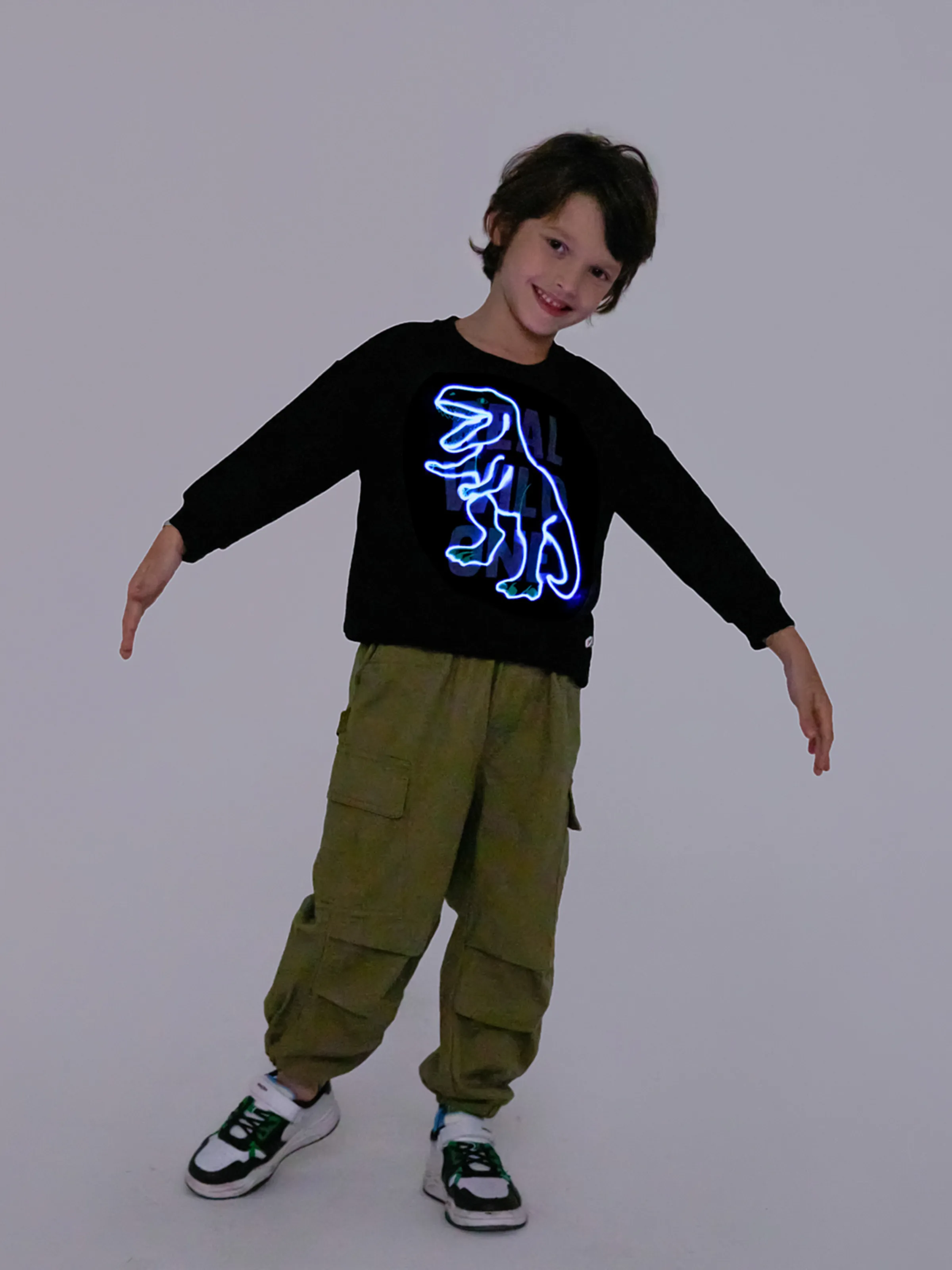 

Go-Glow Illuminating Sweatshirt with Light Up Dinosaur Pattern Including Controller (Built-In Battery)