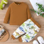 2pcs Baby Boy Solid Cotton Ribbed Long-sleeve Pullover and Allover Dinosaur Print Pants Set Brown